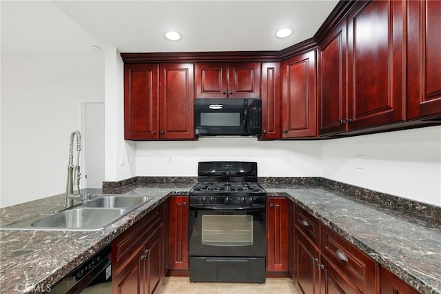 kitchen with black appliances, dark stone countertops, sink, and light tile patterned floors