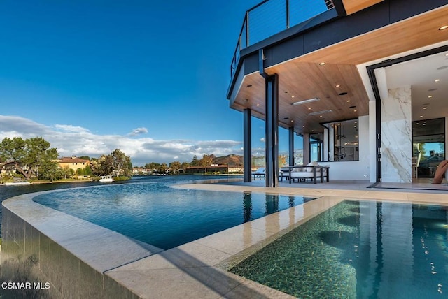 view of pool featuring a patio area