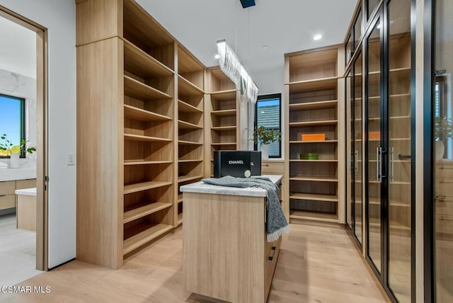 walk in closet featuring light wood-type flooring