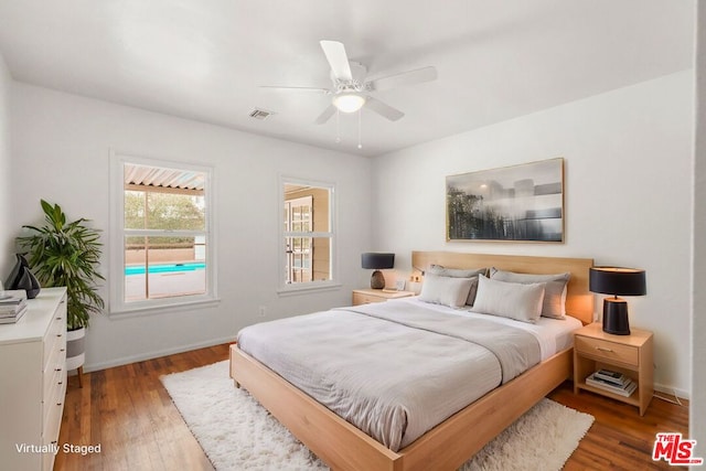 bedroom featuring wood-type flooring and ceiling fan