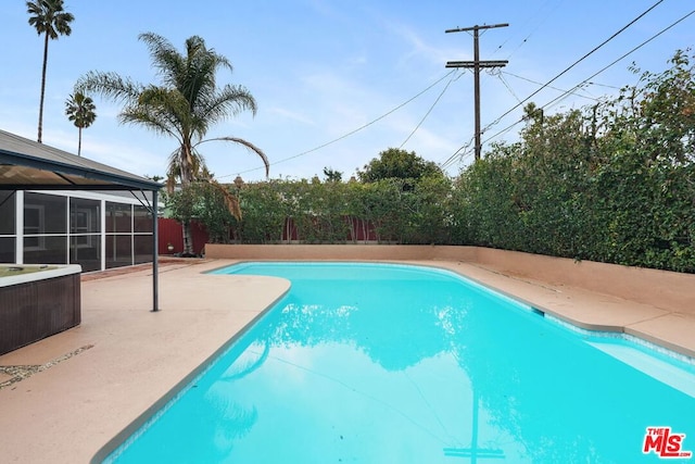 view of pool featuring a patio