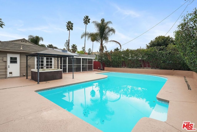 view of swimming pool featuring a patio