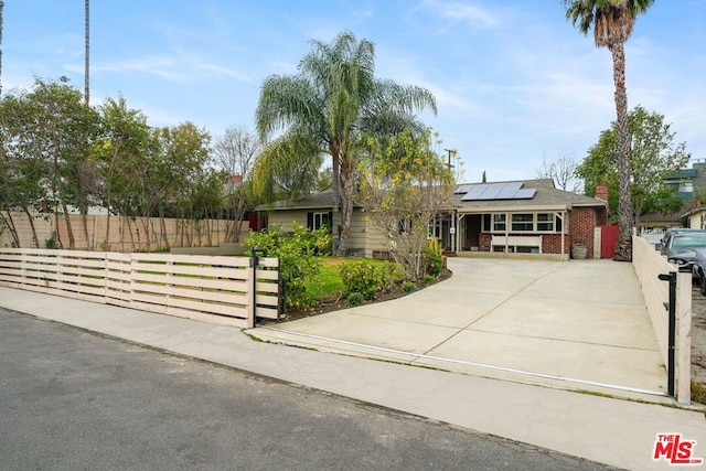 view of front of house featuring solar panels