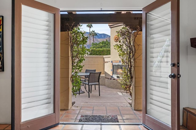 entryway with a mountain view and french doors