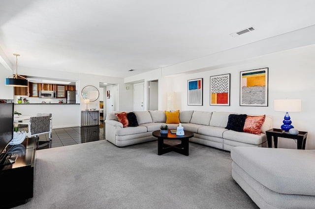 living room featuring dark tile patterned flooring