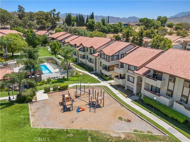 birds eye view of property with a mountain view