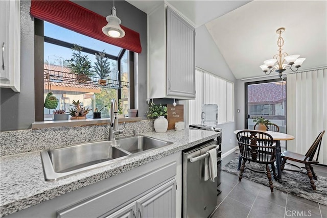 kitchen with white cabinetry, dishwasher, and hanging light fixtures