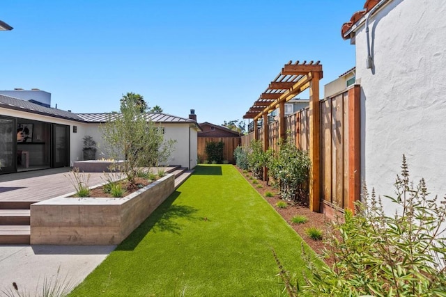 view of yard with a patio area and a wooden deck