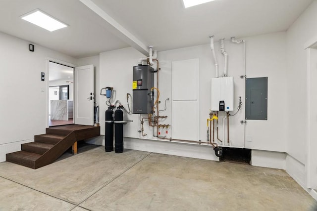 garage with secured water heater, tankless water heater, and electric panel