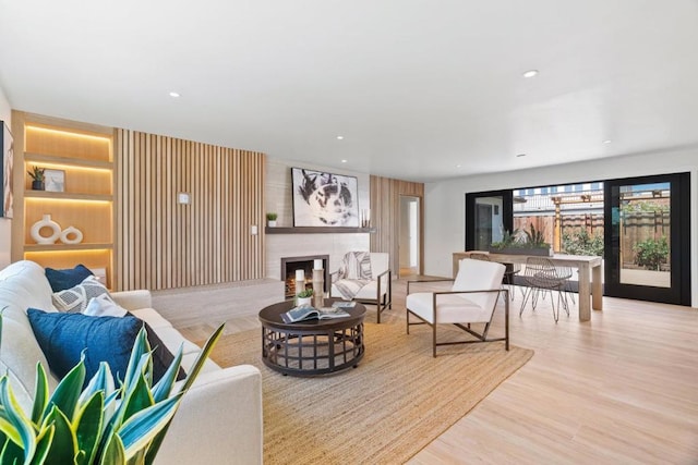 living room featuring light hardwood / wood-style floors and a fireplace