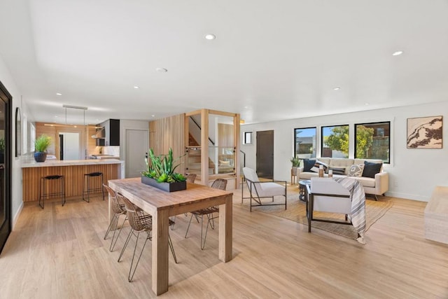 dining space featuring light hardwood / wood-style flooring