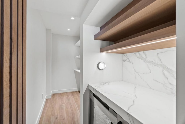 bathroom with hardwood / wood-style flooring