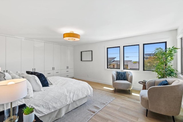 bedroom featuring a closet and light hardwood / wood-style flooring