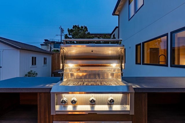 wooden deck featuring a grill