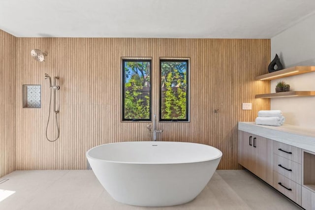 bathroom featuring vanity, independent shower and bath, and wood walls