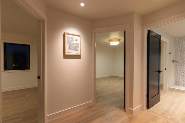 hallway with light wood-type flooring