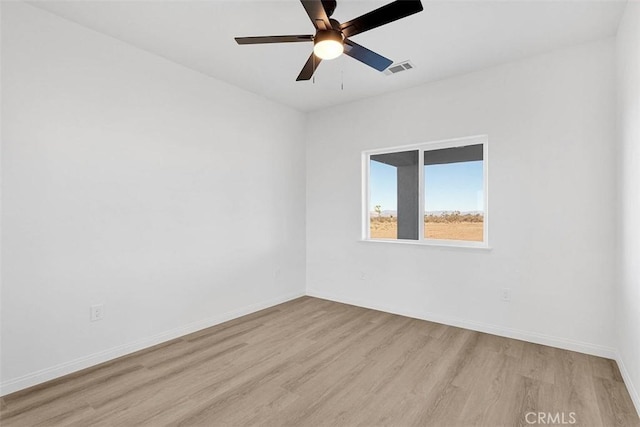 unfurnished room featuring ceiling fan and light hardwood / wood-style flooring