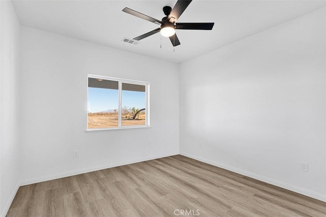 unfurnished room featuring light wood-type flooring and ceiling fan