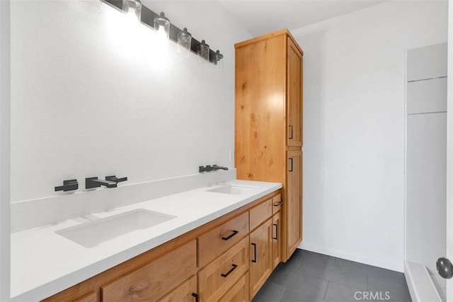 bathroom with tile patterned flooring and vanity