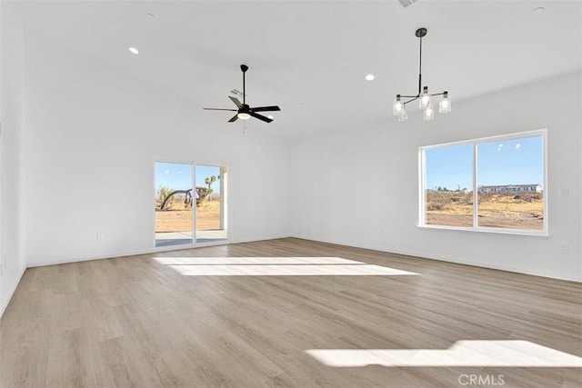 unfurnished living room with light hardwood / wood-style floors, ceiling fan, and basketball hoop