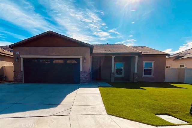 view of front of property with a garage and a front lawn