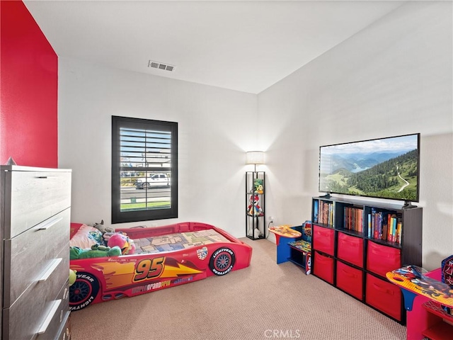 bedroom featuring light carpet