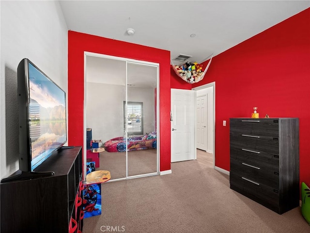 bedroom featuring carpet and a closet