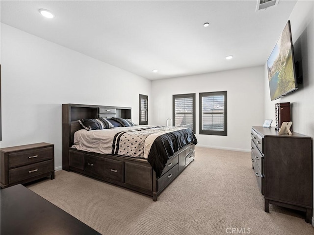 bedroom featuring light carpet