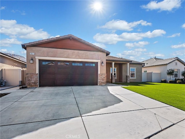 view of front of home featuring a garage and a front yard