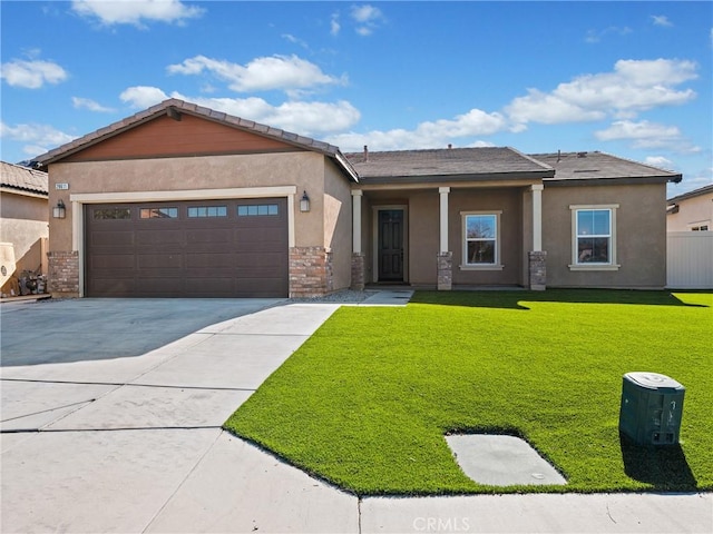 view of front of house featuring a garage and a front lawn