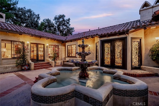 patio terrace at dusk with french doors