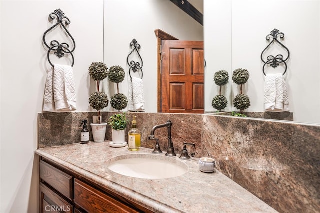 bathroom with backsplash and vanity