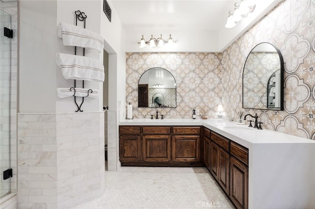 bathroom featuring vanity and an enclosed shower