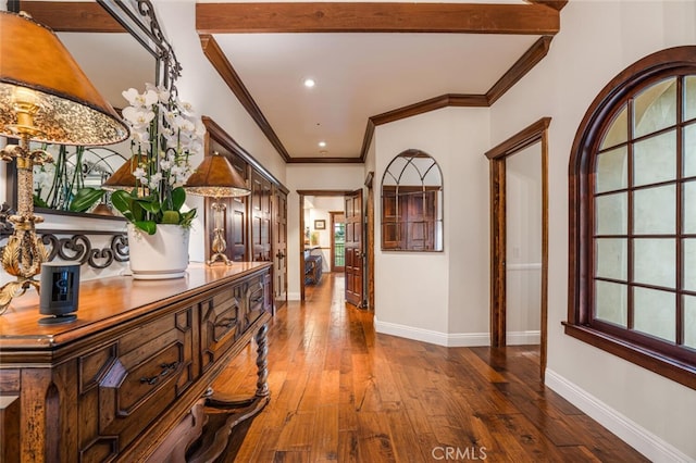 corridor featuring hardwood / wood-style flooring and ornamental molding