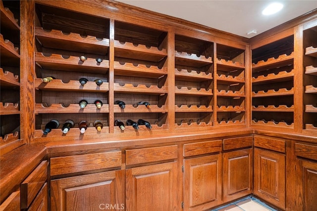 wine area featuring light tile patterned flooring