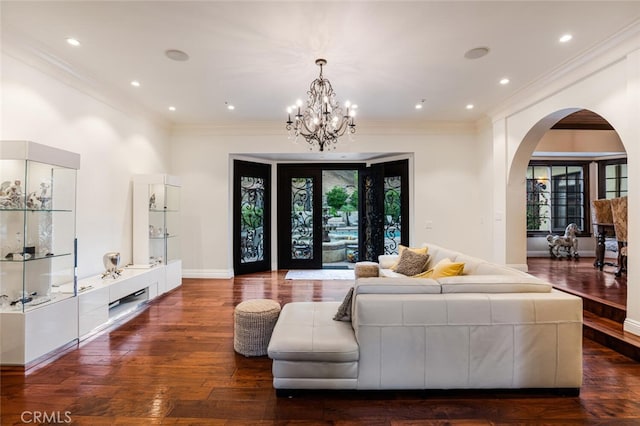 living room with french doors, dark hardwood / wood-style floors, and a notable chandelier