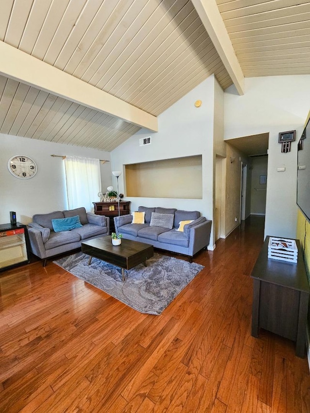 living room with dark hardwood / wood-style flooring and lofted ceiling with beams