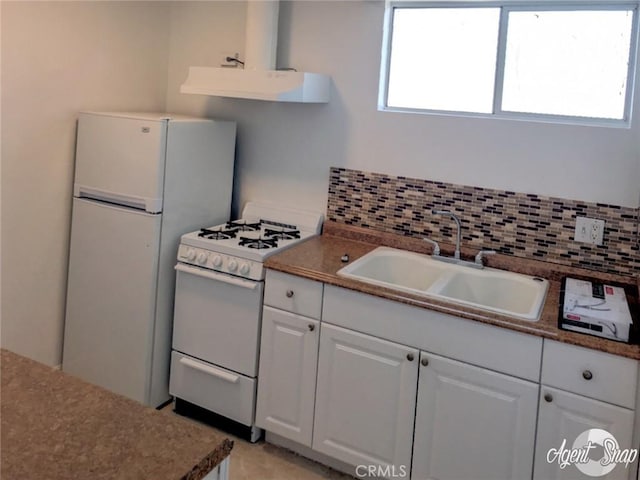 kitchen with white cabinetry, sink, tasteful backsplash, extractor fan, and white appliances