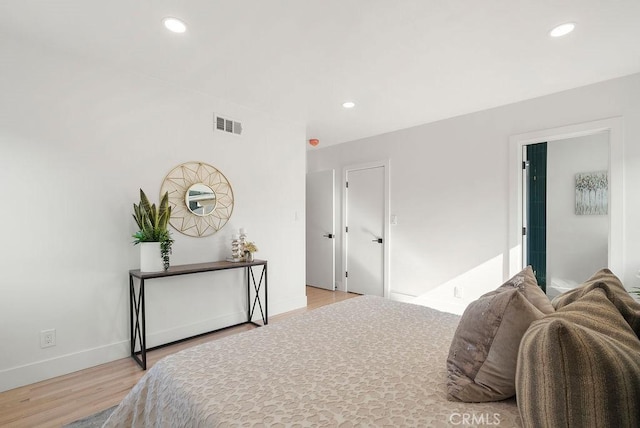 bedroom with light hardwood / wood-style floors