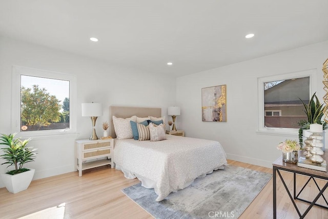 bedroom with light hardwood / wood-style flooring