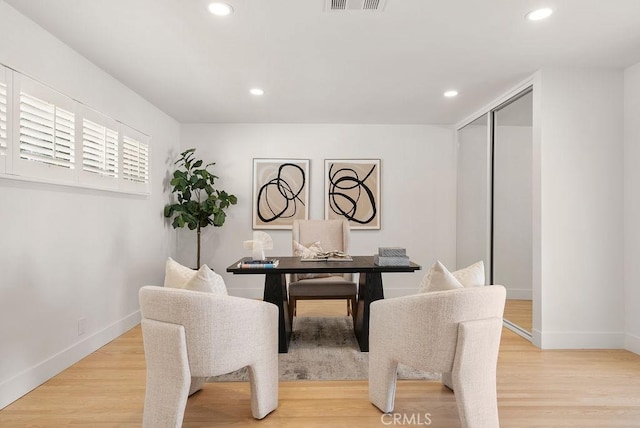 dining space featuring hardwood / wood-style floors