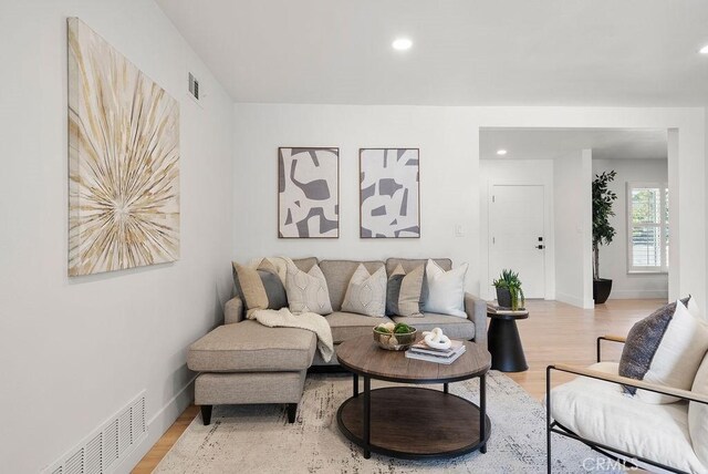 living room with light hardwood / wood-style floors