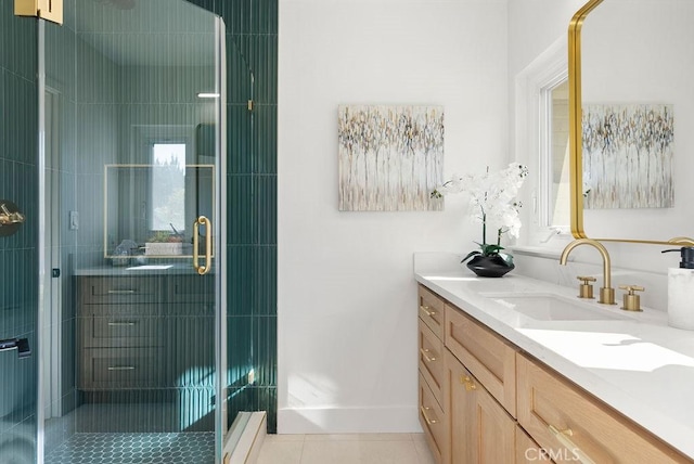 bathroom with tile patterned floors, vanity, and a shower with door