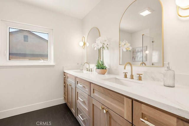 bathroom with tile patterned flooring and vanity