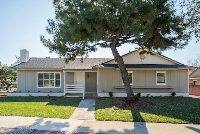 ranch-style home with a front lawn