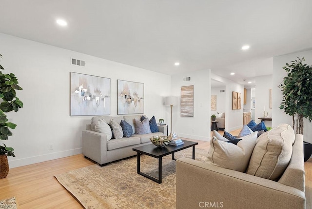 living room with light hardwood / wood-style floors