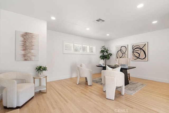 dining space with light hardwood / wood-style floors