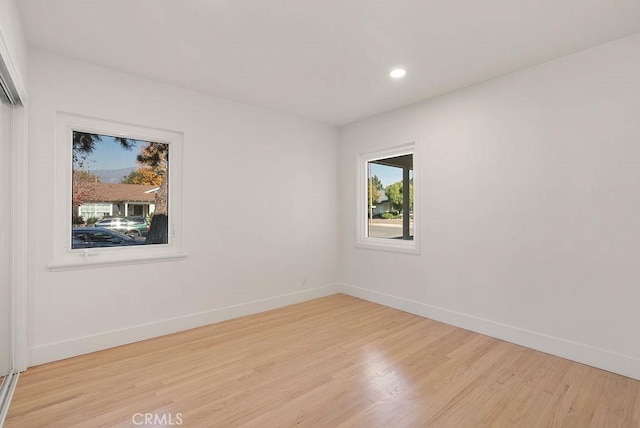 unfurnished room featuring light hardwood / wood-style floors