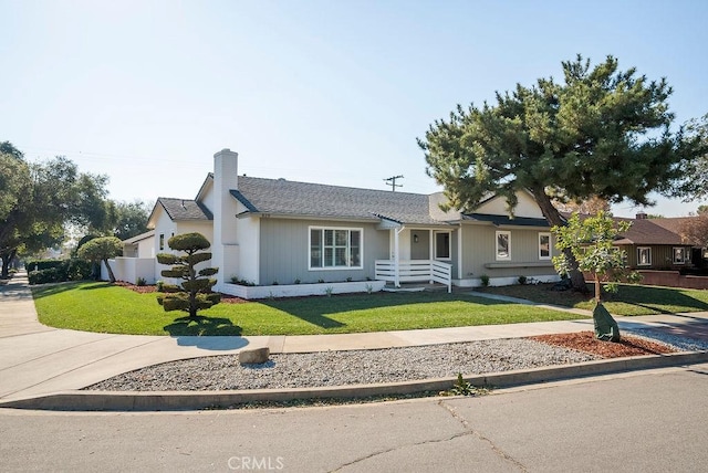 single story home with a front lawn