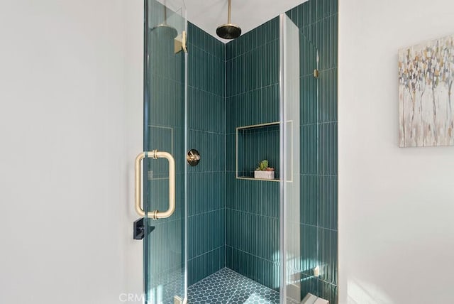 bathroom featuring an enclosed shower